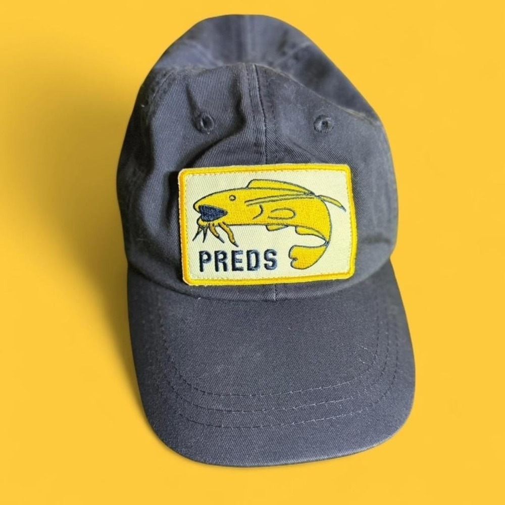 Navy blue NHL cap with yellow and white accents
